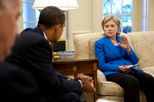 Obama and Hillary discussing how this photo is in the public domain and therefore I can do whatever I want with it, including make up captions that have nothing to do with the photo.  (Official White House Photo by Pete Souza)