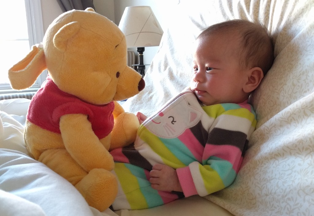 Stella is recognizing "faces" so she's really into dolls and plush toys now. So one morning while getting ready for work, I put Pooh in front of her to keep her calm. It works for a bit.