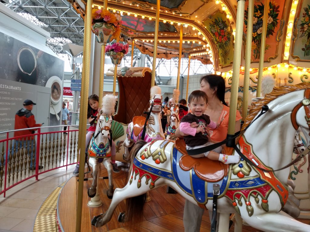 Stella's first carousel ride