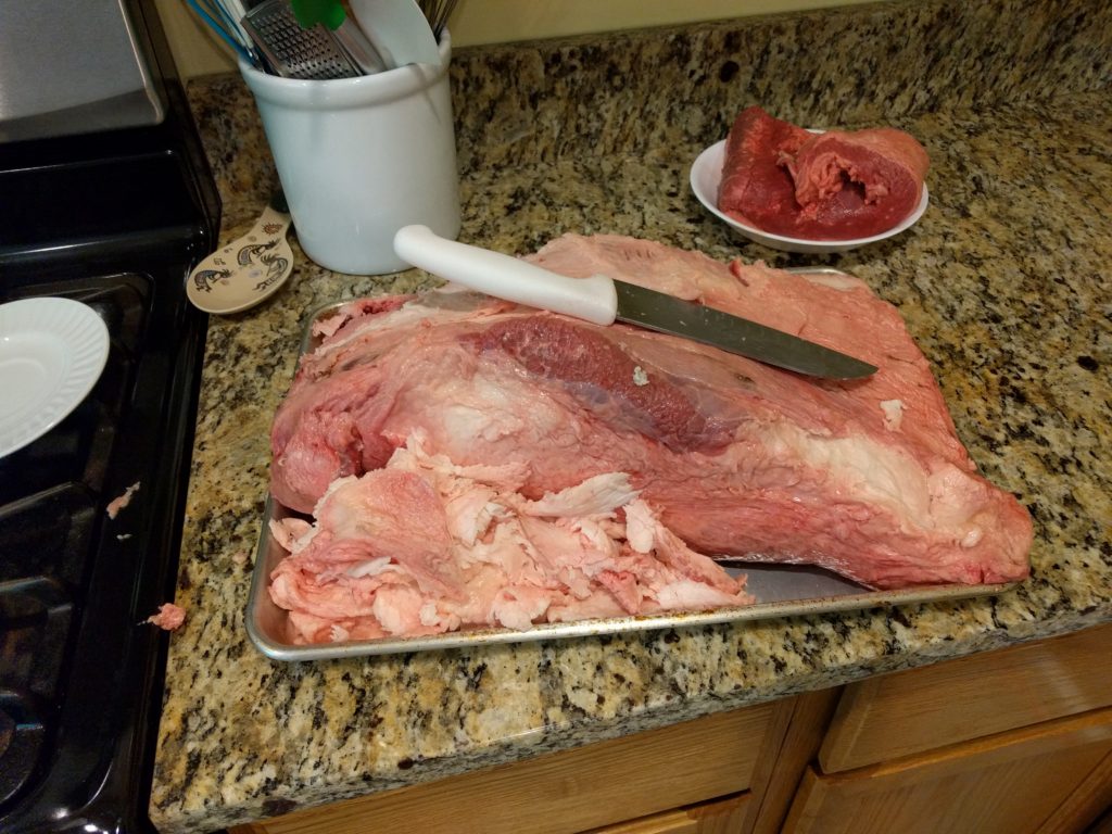 trimming the fat off the brisket
