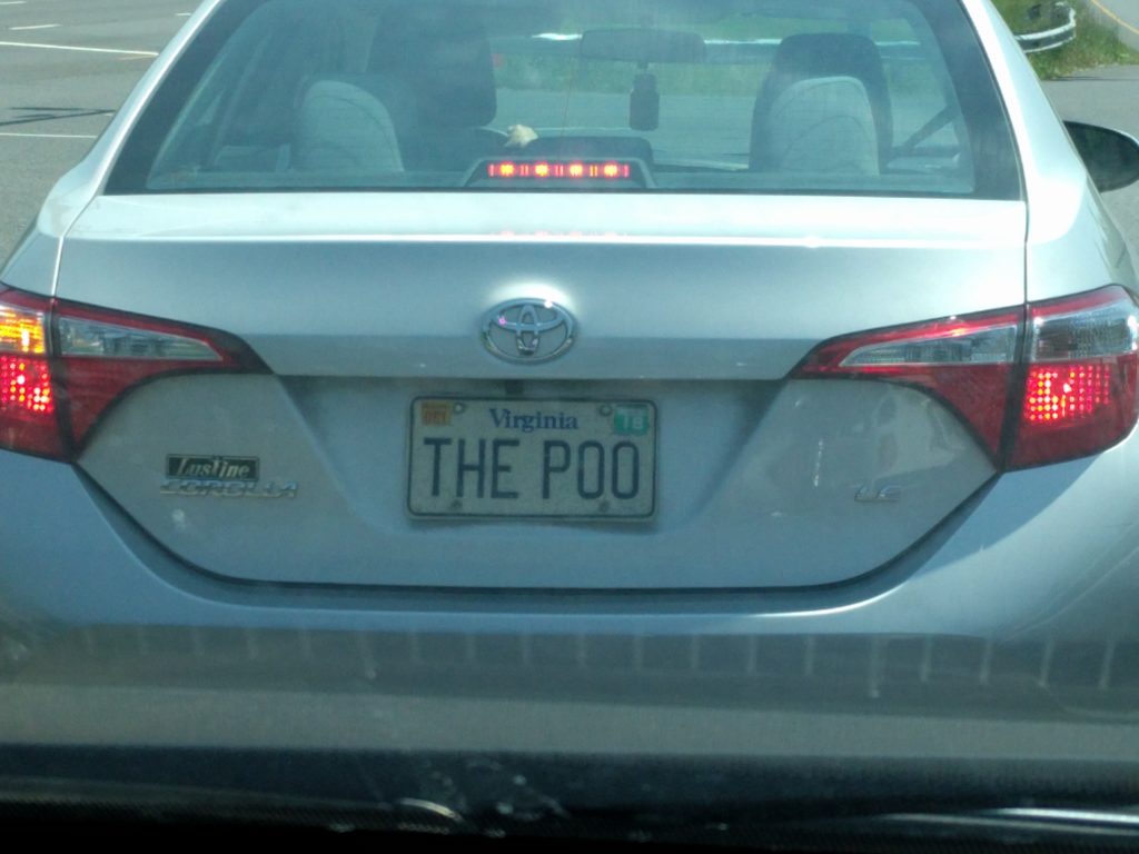 Car with license place "The Poo"