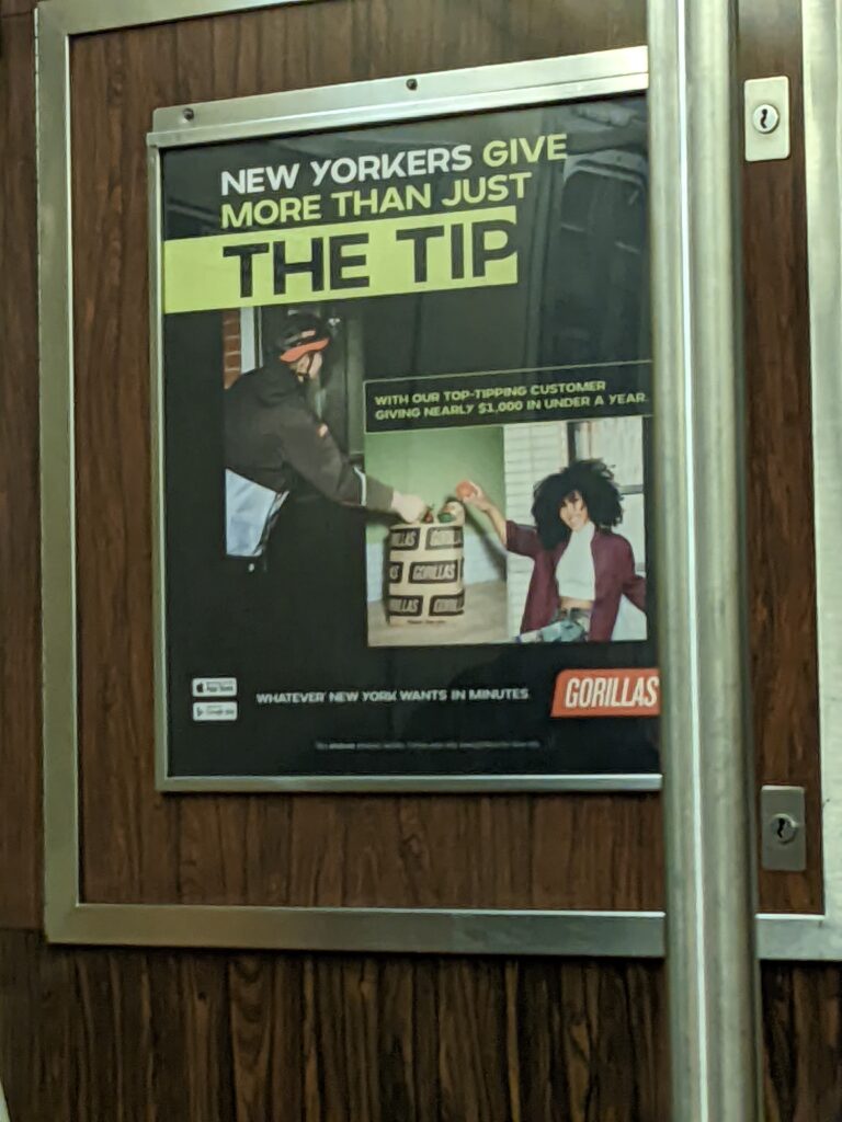 An advertisement on the NYC Subway that reads "New Yorkers Give More Than Just the Tip" "With our top tipping customers giving more nearly $1000 in under a year"