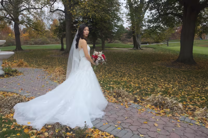 a bride in bridal dress holding flowers