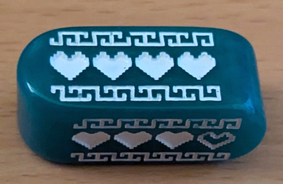 A pill-shaped d4 close up