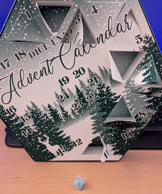 Die in front of advent calendar box that it came from.