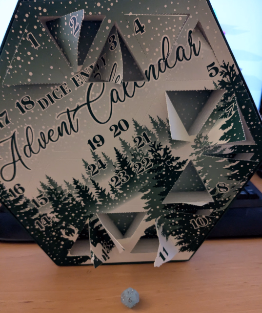 Die in front of advent calendar box that it came from.