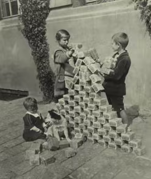 German Kids using inflationary money as blocks in 1923 - Bitcoin is supposed to be immune to this