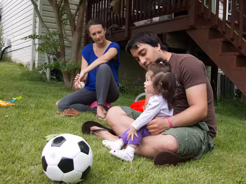 Scarlet watching Daddy play catch