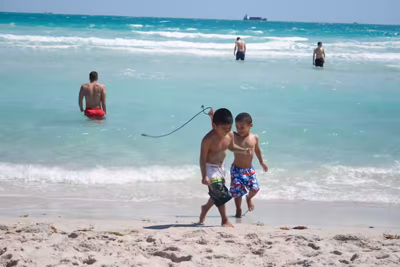 Brothers Walking Along the Beach
