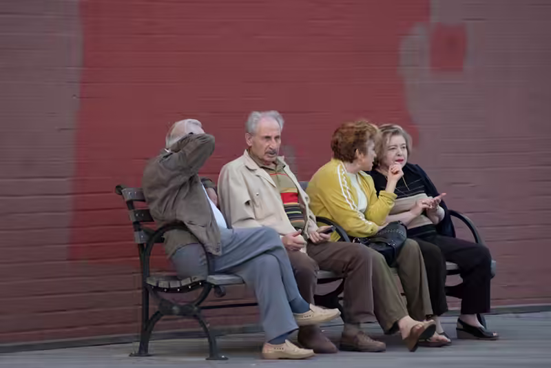 Friends on a Boardwalk Bench