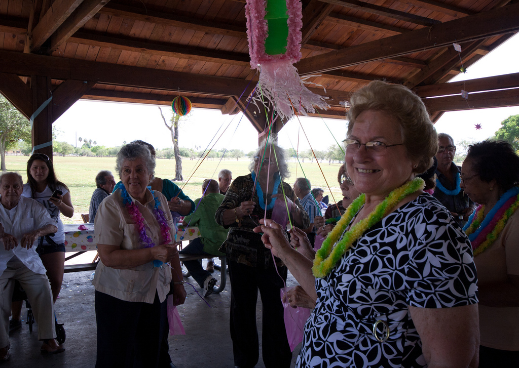 Adults Pulling the Piñata Strings