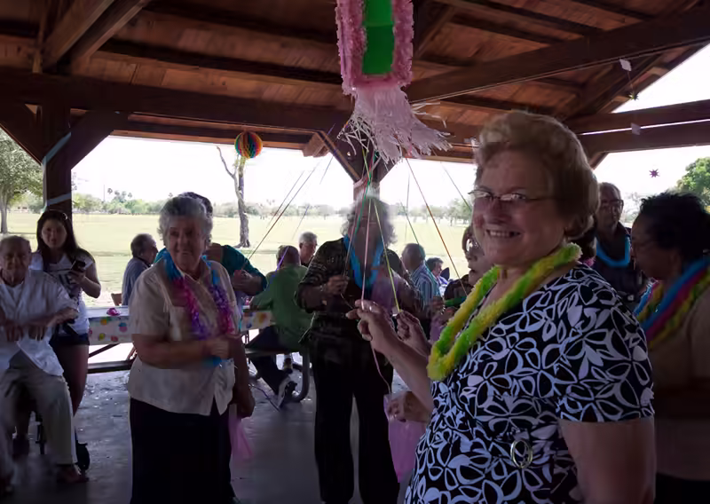Adults Pulling the Piñata Strings