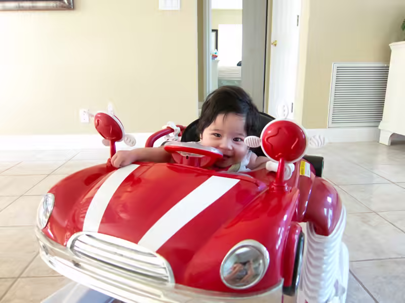 Driving along in her automobile