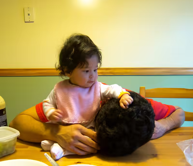 Playing with Daddy’s Hair in the Kitchen