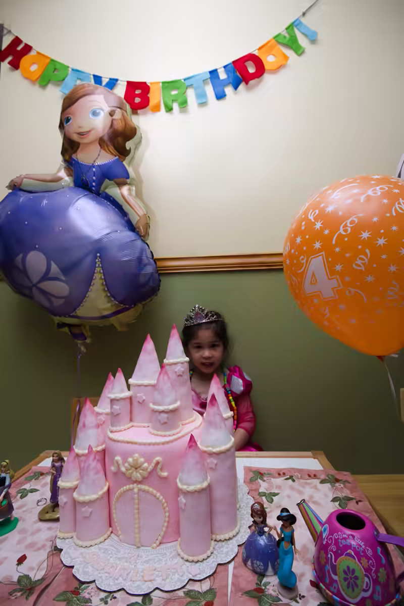 Scarlett, her cake, and some fellow princesses