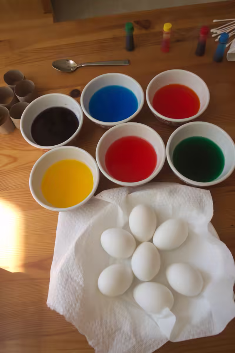 The colors are ready for Scarlett to dip the eggs in.
