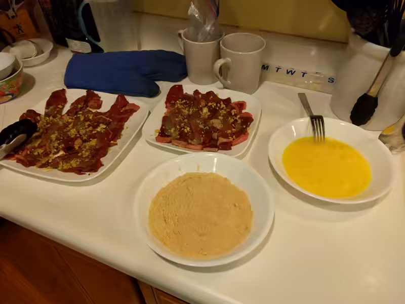 The eggs and breading ready for cooking
