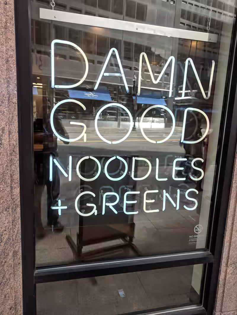 a sign that reads &lsquo;Damn good noodles&rsquo;