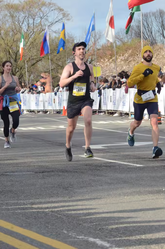 three runners (including me) and spectators at the race