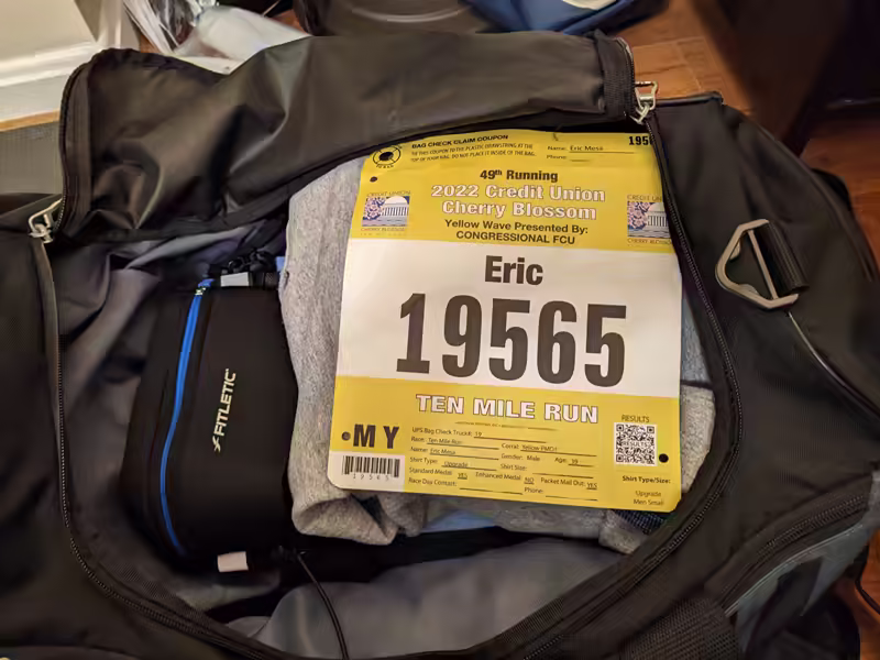 gym bag full of racing gear with the event’s big on top