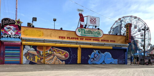 Nathan's Famous Hot Dogs in Coney Island with a painting on the doors