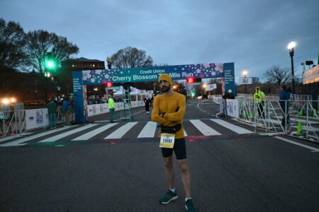 Me at the starting/finish line of the Cherry Blossom race as last minute prep work is done on the sign